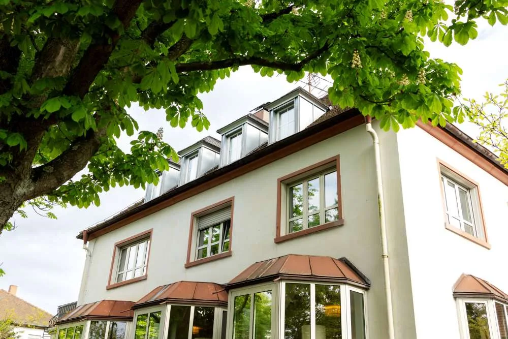 a two-story house with high windows